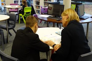 A woman reading with a child.jpg