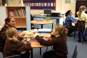 children reading with a lady.jpg