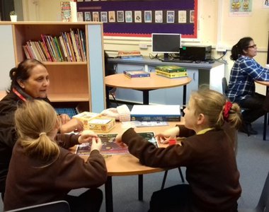 children reading with a lady.jpg